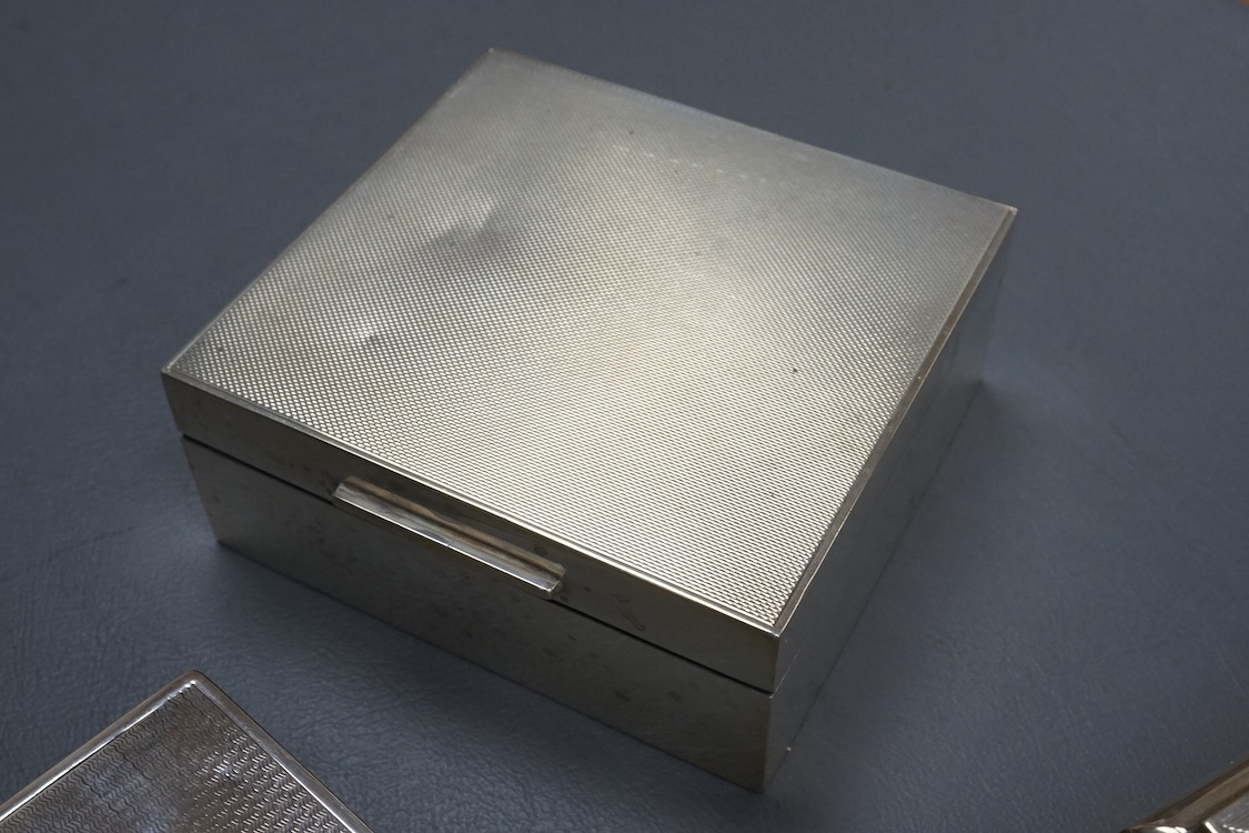 Three assorted silver mounted cigarette boxes, the largest by Frederick William Hentsch, London, 1924, 14.3cm.